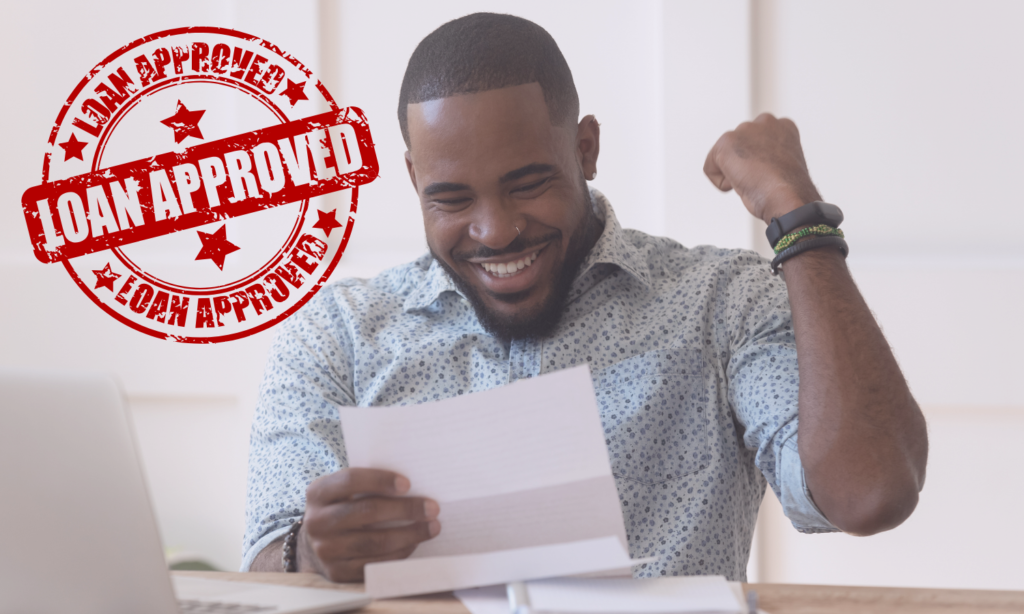 Happy african american guy received banking loan approval.